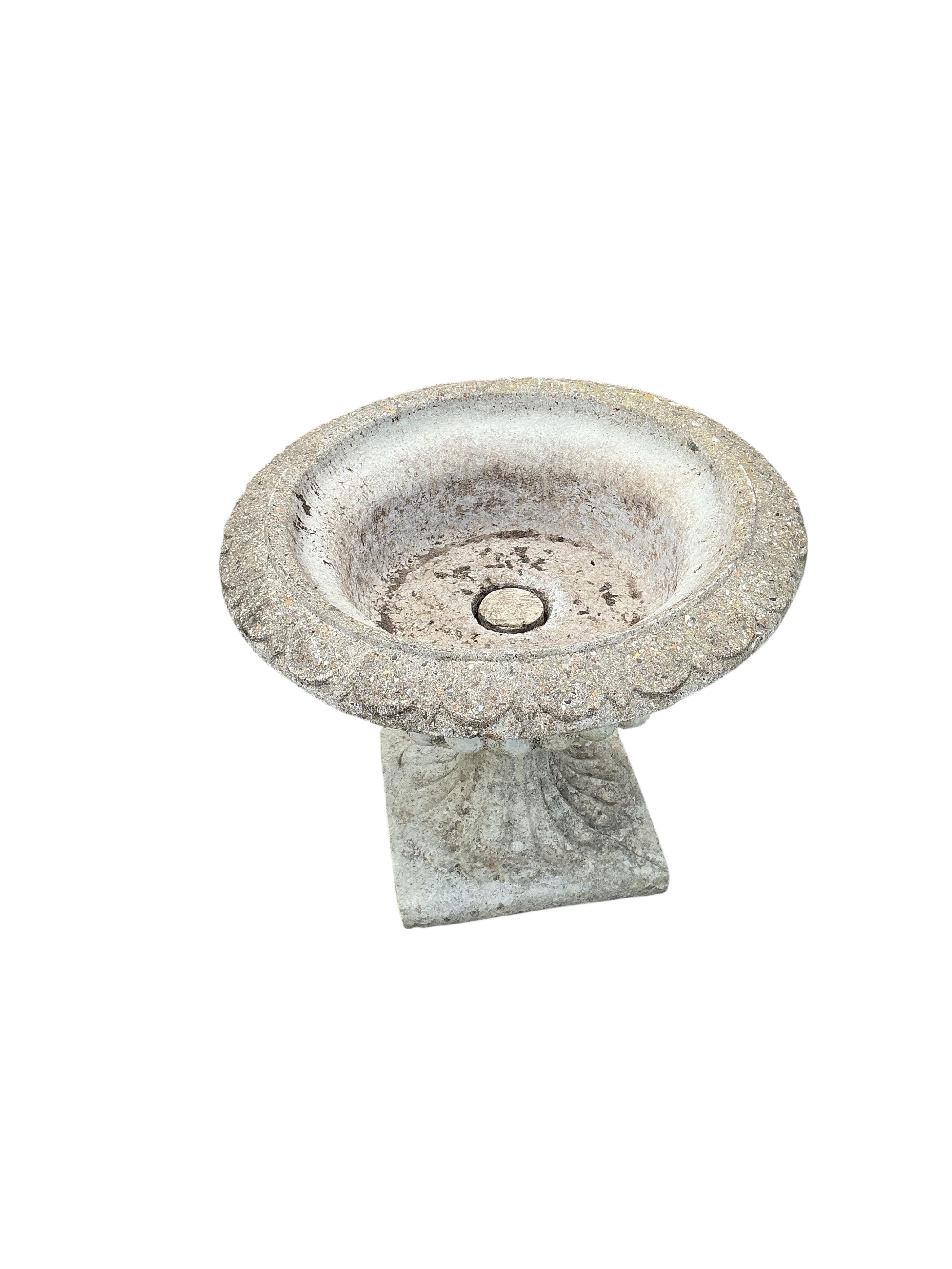 A pair of circular reconstituted stone campana garden urns, diameter 61cm, height 53cm